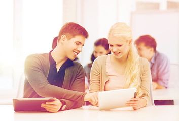 Image showing students looking at tablet pc in lecture at school