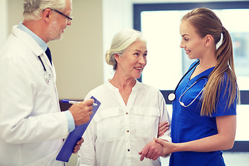 Image showing medics and senior patient woman at hospital