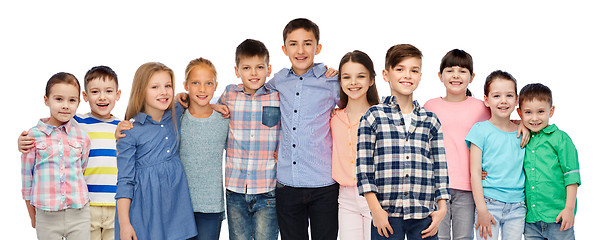 Image showing group of happy smiling children hugging over white