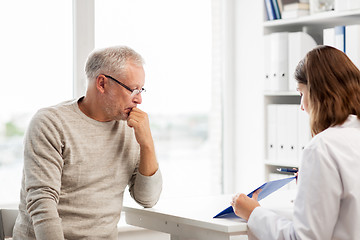 Image showing senior man and doctor meeting at hospital