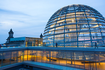 Image showing Illuminated glass dome on the roof of the Reichstag in Berlin at dusk.