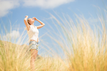 Image showing Free Happy Woman Enjoying Sun on Vacations.