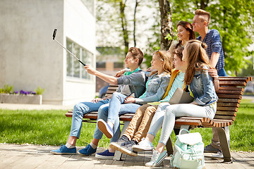 Image showing happy teenage students taking selfie by smartphone