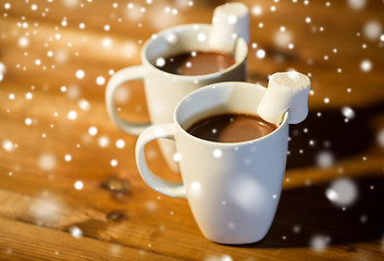 Image showing cups of hot chocolate with marshmallow on wood