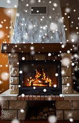 Image showing close up of burning fireplace with snow