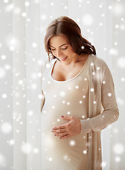 Image showing happy pregnant woman with big tummy at home