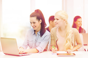 Image showing students with laptop, tablet pc and notebooks