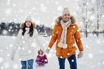 Image showing happy family with sled walking in winter outdoors