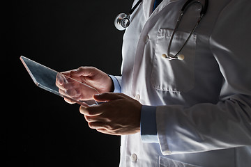 Image showing close up of doctor with tablet pc and stethoscope