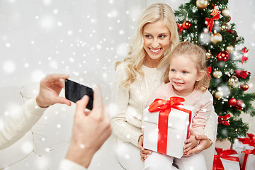 Image showing family taking picture with smartphone at christmas