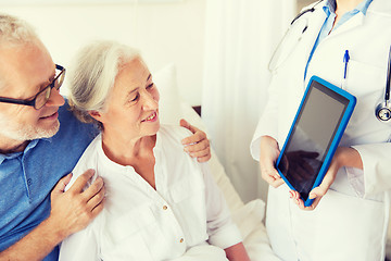 Image showing senior woman and doctor with tablet pc at hospital