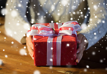 Image showing close up of woman with christmas gift