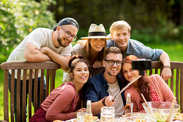 Image showing friends taking selfie at party in summer garden