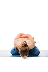 Image showing Woman doing asana Yoga mudrasana