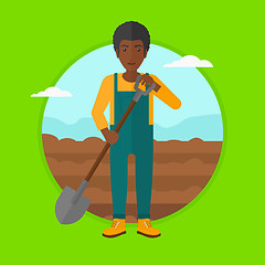 Image showing Farmer on the field with shovel.