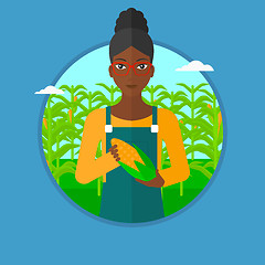 Image showing Farmer holding corn vector illustration.