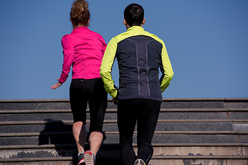 Image showing young  couple jogging on steps