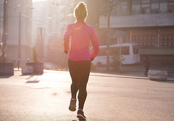 Image showing sporty woman jogging on morning