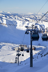 Image showing Gondola lift on ski resort at sun evening