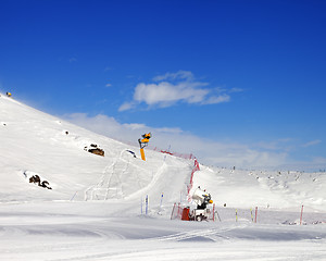 Image showing Ski slope with snowmaking at sun day