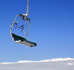 Image showing Chair-lift in ski resort at sun day