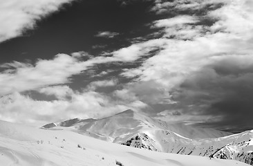 Image showing Black and white ski slope and sky with clouds in evening