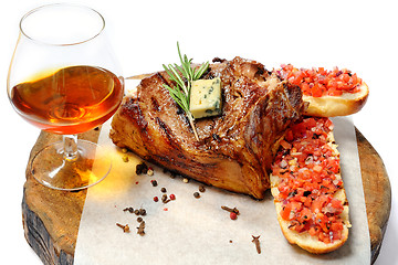 Image showing fried steak on a wooden board