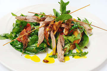 Image showing Pumpkin salad with crispy duck and greens