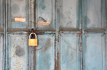 Image showing Metal lock on a blue door
