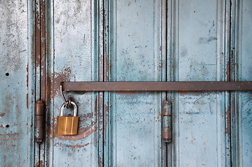 Image showing Metal lock on a blue door