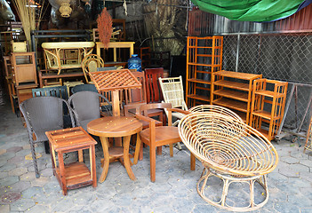 Image showing Wooden furniture outside their shop