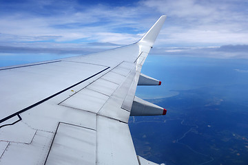 Image showing Wing of an airplane on blue sky