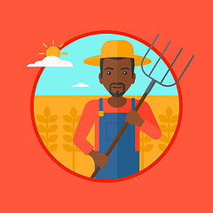 Image showing Farmer with pitchfork in wheat field.