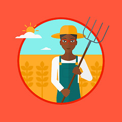 Image showing Farmer with pitchfork in wheat field.