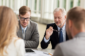 Image showing architects with tablet pc and blueprint at office