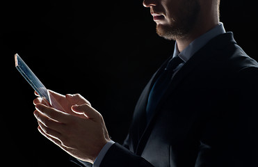 Image showing close up of businessman with transparent tablet pc