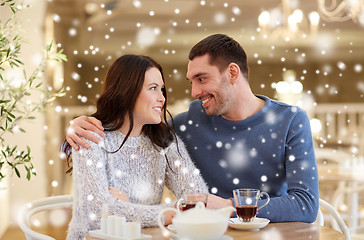 Image showing happy couple drinking tea at restaurant