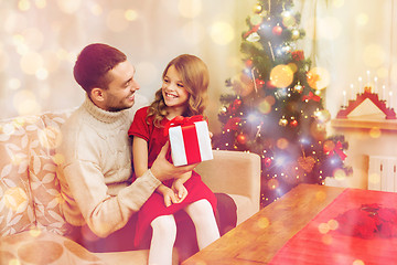 Image showing smiling father and daughter looking at each other