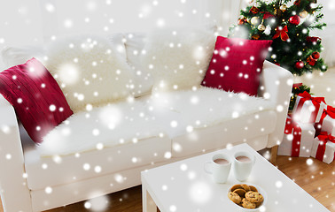 Image showing close up of christmas cookies and cups on table