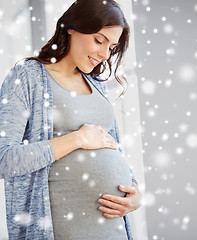 Image showing happy pregnant woman with big tummy at home