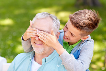 Image showing grandfather and grandson playing at summer park