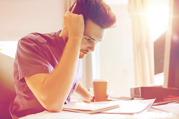 Image showing creative male office worker with coffee thinking