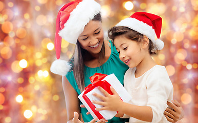 Image showing happy mother and child girl with gift box