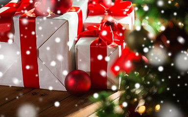 Image showing gift boxes and red balls under christmas tree