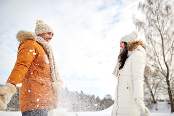 Image showing happy couple playing with snow in winter