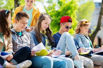 Image showing group of students with notebooks at school yard