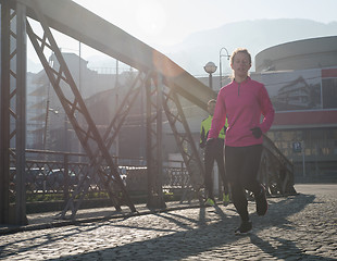 Image showing sporty woman jogging on morning