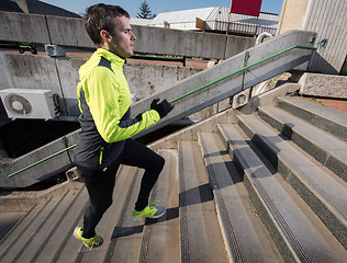 Image showing man jogging on steps