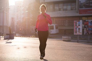 Image showing sporty woman jogging on morning