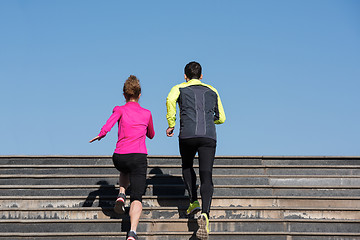 Image showing young  couple jogging on steps